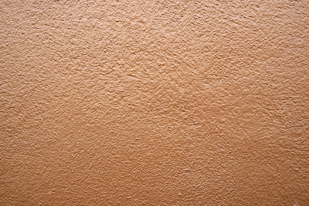 Texture de mur de ciment brun