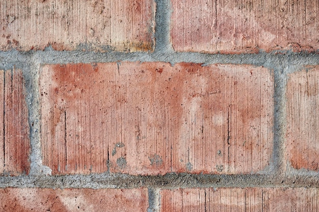 Texture d'un mur de ciment de couleur orange joint avec du ciment