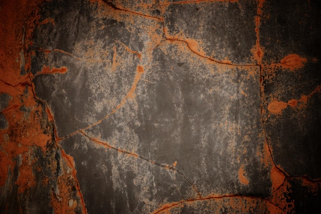 Texture de mur de ciment foncé pour les vieux murs de fond pleins d'égratignures et de taches