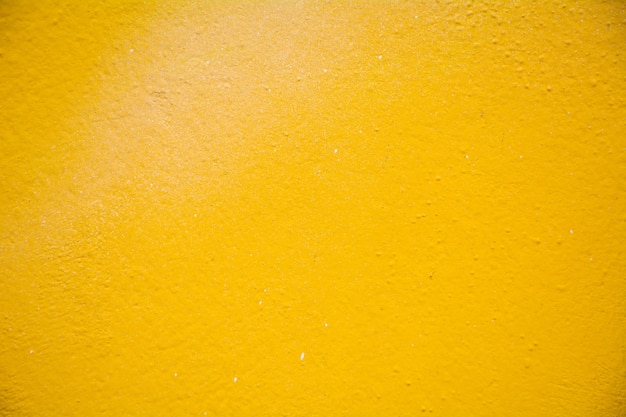 Texture de mur de ciment jaune