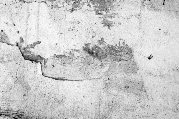 Texture, mur, fond en béton. Fragment de mur avec rayures et fissures