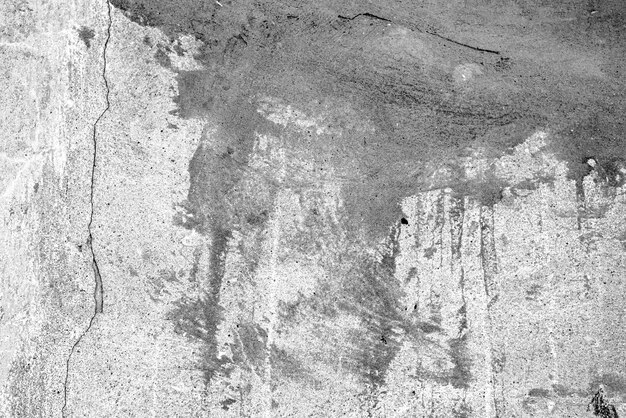 Texture, mur, fond en béton. Fragment de mur avec rayures et fissures