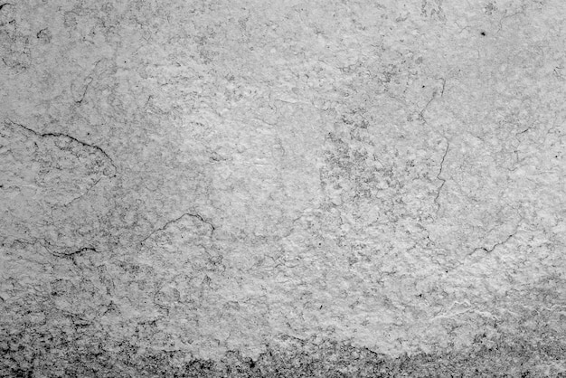 Texture, mur, fond en béton. Fragment de mur avec rayures et fissures