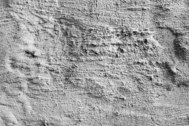 Texture, mur, fond en béton. Fragment de mur avec rayures et fissures