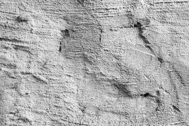 Texture, mur, fond en béton. Fragment de mur avec rayures et fissures