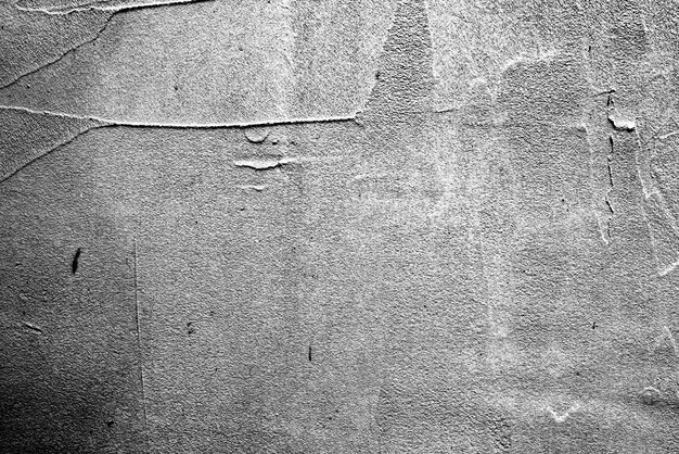 Texture, mur, fond en béton. Fragment de mur avec rayures et fissures