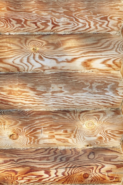 Photo texture de mur jaune maison en bois rond, motif de surface naturelle