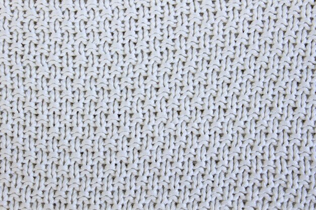 Texture naturelle douce et légère de fond de matière textile en laine tricotée Toile tissée en coton au crochet blanc