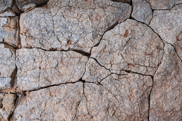 Texture naturelle d'une roche ancienne avec des fissures dans la région d'atacama