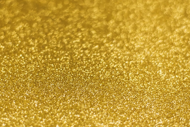 Texture de paillettes d'or brillant doré abstrait de Noël.