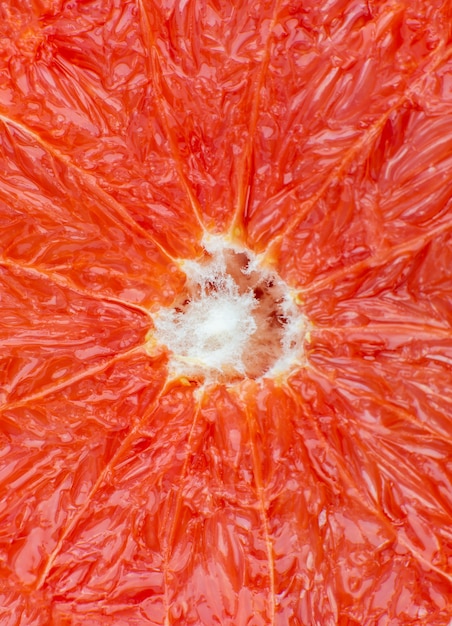 Texture De Pamplemousse à L'intérieur Sur Le Fond Blanc. Citrus En Gros Plan Photo. Photo De Mode De Vie Sain. Beau Fond D'écran. Concept Végétarien Et Végétalien. Vitamines De La Nature.