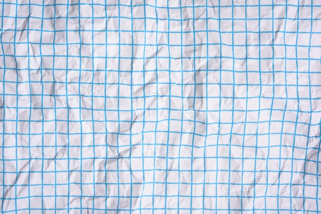 Photo texture de papier blanc froissé dans une cage lignes bleues cahier d'école