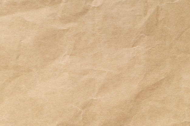 Texture de papier froissé brun pour le fond.