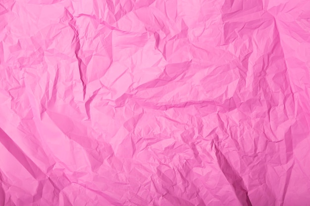 Texture de papier froissé rose abstrait