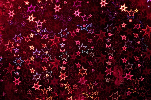 Texture de papier holographique rouge. Fond de Noël