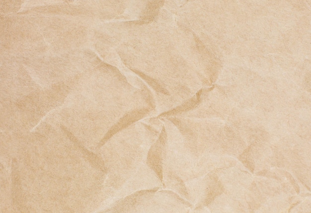 Texture de papier kraft brun, arrière-plan naturel de recyclage écologique.