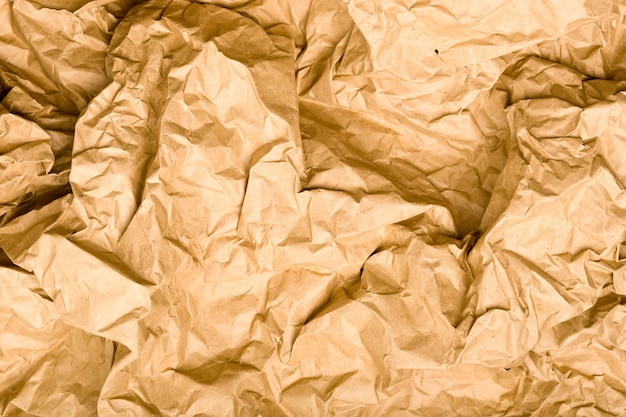 Photo texture de papier kraft froissé. espace vintage marron naturel