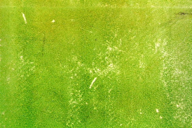 Texture de papier vieux vert minable avec des rayures. Fond abstrait