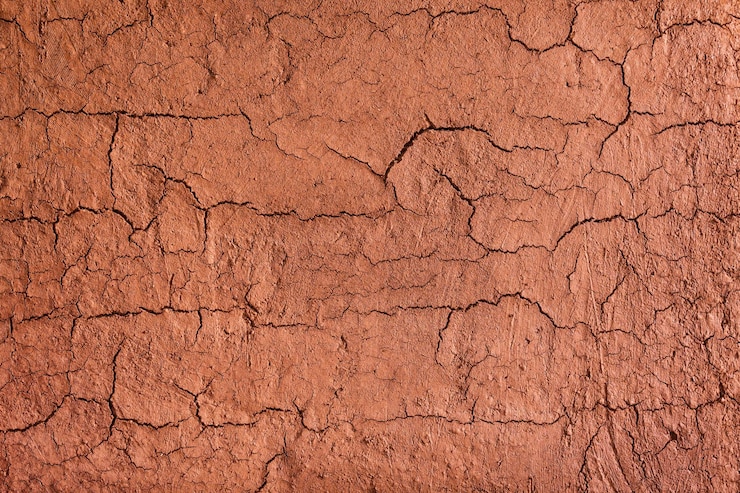 Photo la texture de la paroi du sol de l'abri en terre, également appelée maison en terre, la maison en terre est une structure généralement une maison avec un sol en terre contre les murs