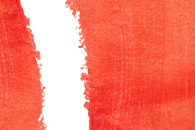 Photo texture de peinture acrylique rouge sur fond de papier blanc