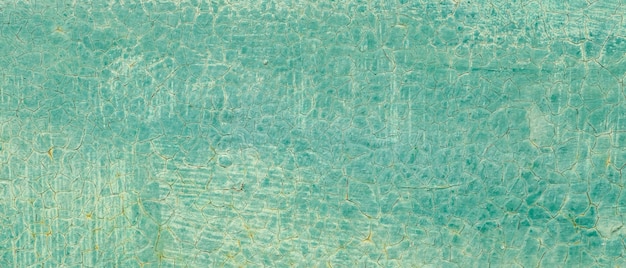 Texture de peinture turquoise fissurée