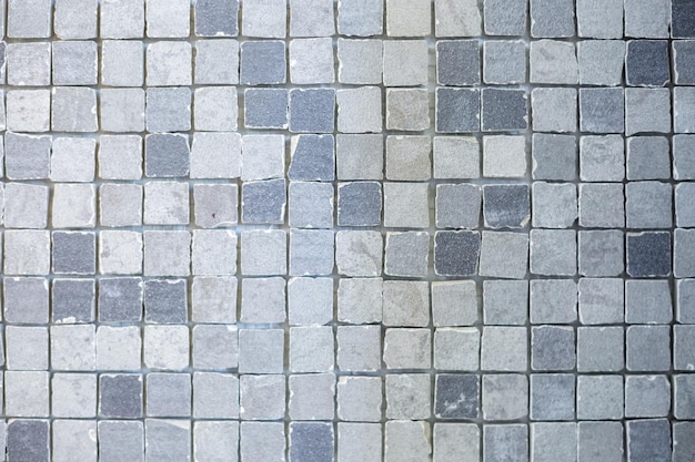 Texture de petits carreaux de céramique dans un contexte chaotique pour l'intérieur d'élite de la salle de bain wc toilettes et toilettes