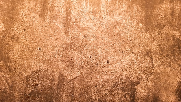 Photo texture de pierre de granit. fond de pierre dorée brune. ancienne surface de mur de pierre vide ou ancien fond de texture de papier brun sale marron ou beige. grunge d'or brun.