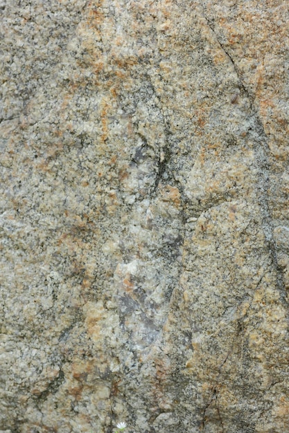 Texture de pierre de granit Mur de granit en pierre naturelle avec structure rugueuse Fond de granit