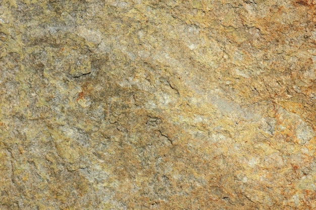 Texture de pierre de granit Mur de granit en pierre naturelle avec structure rugueuse Fond de granit