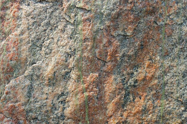 Texture de pierre de granit. Surface de roche de granit fissurée. Toile de fond en pierre naturelle. Fermer