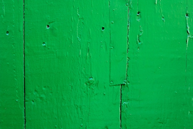 Texture de planche de bois peint vert patiné fissuré