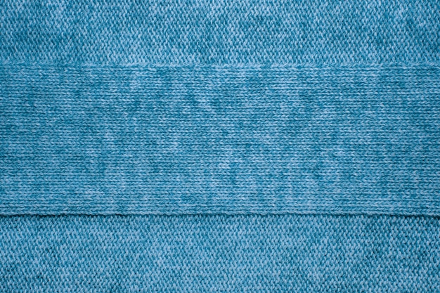 Texture de pull en laine se bouchent. Fond en jersey tricoté avec un motif en relief. Tresses en modèle de tricot machine