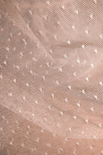 La texture d'une robe rose pâle