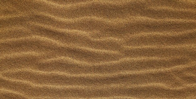 Une texture de sable brun avec des vagues en arrière-plan.