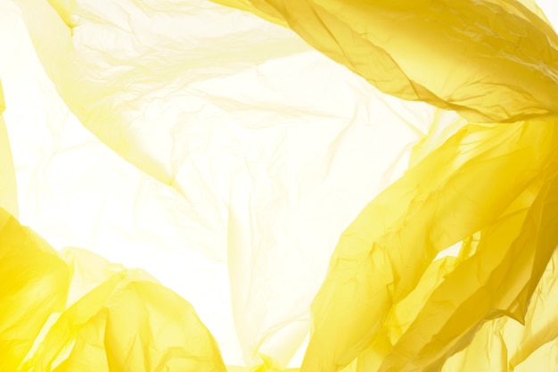 Texture de sac en plastique jaune. Fond en plastique jaune.
