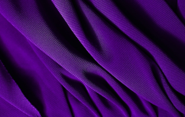 La texture satinée violette élégante et lisse peut être utilisée comme arrière-plan abstrait. Design de fond luxueux. Texture violet gros plan