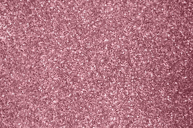 Texture scintillante abstraite de paillettes d'or rose