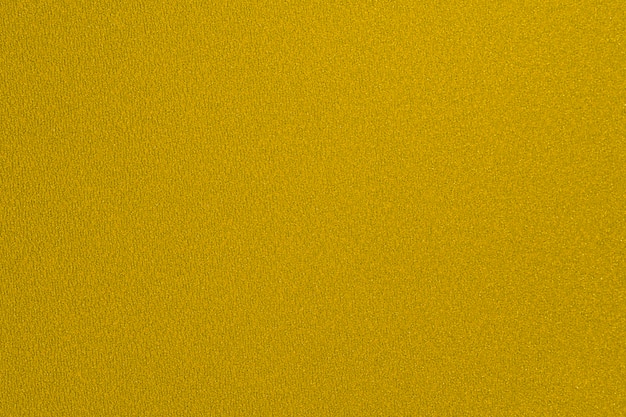 Texture scintillante de fond de feuille de papier jaune doré