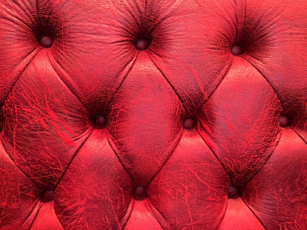 Texture de sellerie en cuir véritable rouge pour une décoration de luxe