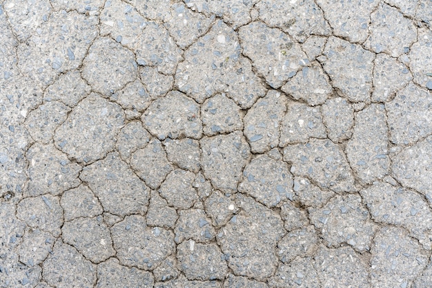 Texture de sol en béton ancienne route fissure.