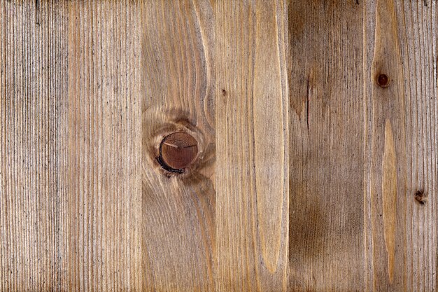 Texture de la surface en bois brun tonique avec des noeuds