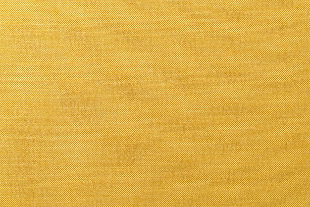 texture de surface de tissu moutarde jaune ou doré en gros plan pour le fond