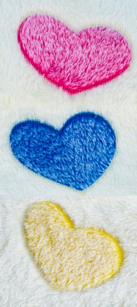 Texture de tapis en laine avec fond de motif coeur coloré