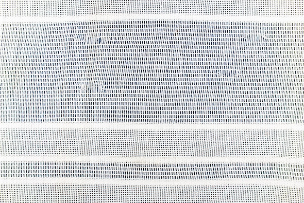 Texture de tissu ancien blanc Vieux tissu filamenteux fond finMatière tissée sale légère