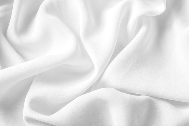 Texture de tissu blanc pour le fond et la conception de beaux motifs de soie ou de lin
