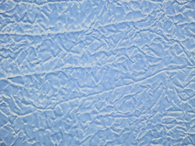 Texture de tissu brocart bleu froissé