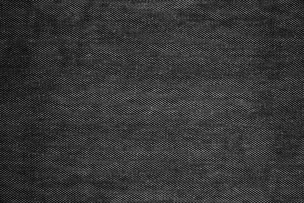 Texture de tissu denim foncé monochromatique pour le fond