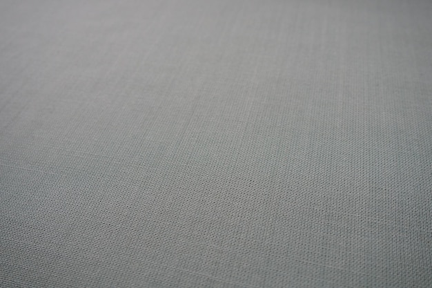 Texture de tissu de fond gris Un morceau de tissu de laine est soigneusement disposé sur la surface Weave