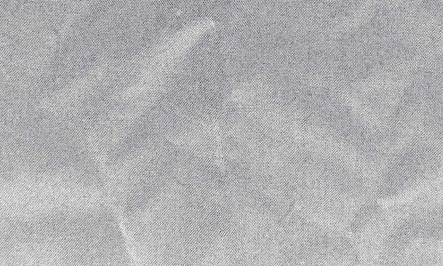 Texture de tissu froissé d'aubergine pour le fond