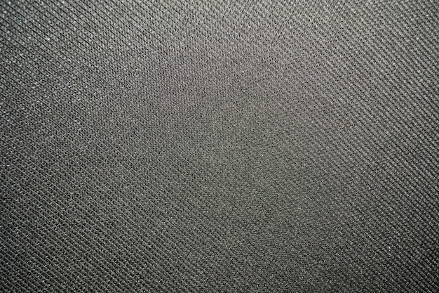 Texture d&#39;un tissu gris uniformément éclairé